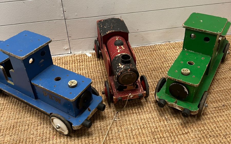 Three wooden vintage pull along trains, one by Puff Puff