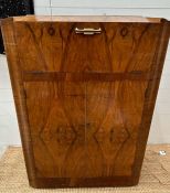 A Mid Century cocktail cabinet with drop down mirrored preparation area and two door cupboard (