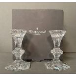 A Boxed set of Waterford Crystal candlesticks.