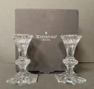 A Boxed set of Waterford Crystal candlesticks.