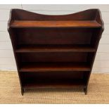 A free standing mahogany open bookcase (H76cm W93cm D21cm)