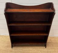 A free standing mahogany open bookcase (H76cm W93cm D21cm)