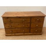 A six drawer pine chest of drawers (H67cm W118cm D44cm)