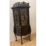 A mahogany display parlour cabinet with three carved vine motif glazed panels and cupboard under