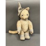A vintage French cat soft teddy bear with jointed arms and legs and felt cuffs, feet and hat