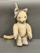 A vintage French cat soft teddy bear with jointed arms and legs and felt cuffs, feet and hat