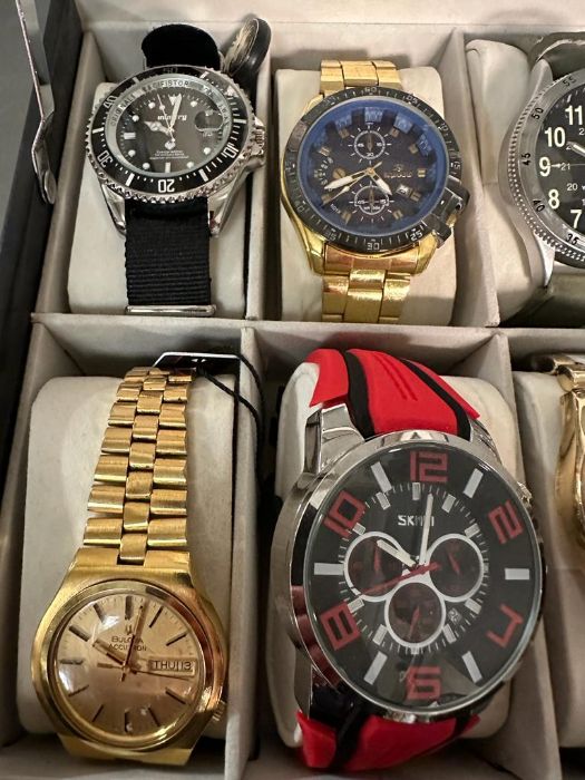 A selection of wristwatches in display case to include: Bulova, Geneva, Skmei, Infantry, 18 in - Image 5 of 6