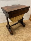 A George IV rosewood work table with hinged top and lined drop well (H74cm W61cm D41cm)