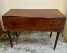 A mahogany drop leaf Pembroke table on castors