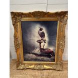 A wooden gold painted framed print on canvas of a hawk titled "The Hunter"