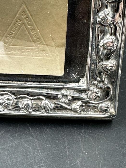 A good Art Nouveau silver embossed photograph frame, Birmingham 1901, together with period 1915 - Image 4 of 5