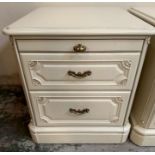 A pair of two drawer white painted bedside tables