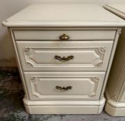 A pair of two drawer white painted bedside tables
