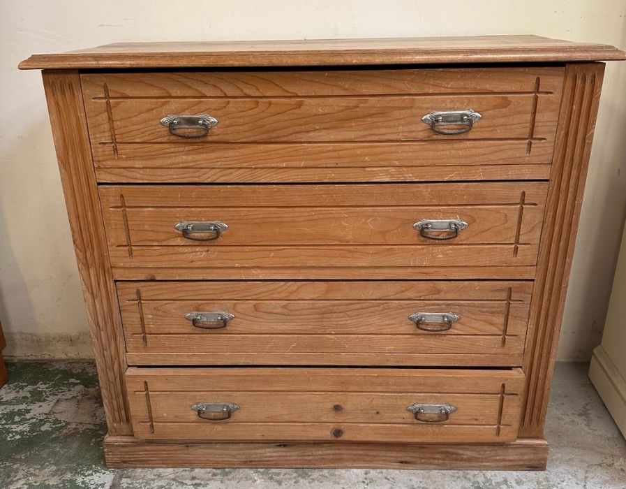 A pine four drawer chest of drawers (H93cm W106cm D46cm)