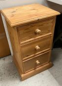 A pine three drawer side cabinet or bedside (H67cm W38cm D32cm)