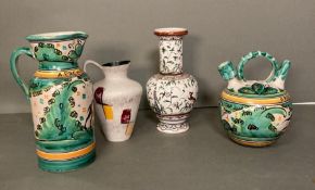 A selection of continental ceramics to include jugs, ewer and a vase