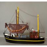 A wooden painted scale model fishing boat, The Mary Jane