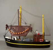 A wooden painted scale model fishing boat, The Mary Jane