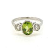 Platinum peridot and diamond 3 stone ring Peridot 1.50 carats Diamond 0.40 carats in total