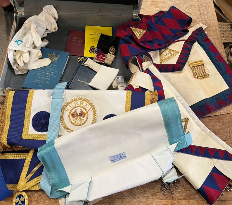 A selection of masonic medals, aprons and sashes
