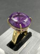 An 18ct yellow gold ring with substantial amethyst stone(21mm x 18mm) and approximate total ring