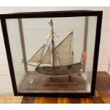 A model of "The Stuart Yacht 1670" in a glazed display case