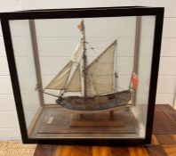 A model of "The Stuart Yacht 1670" in a glazed display case