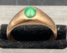 A gold and jade ring, size O, approximate total weight 6.9g