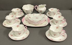 A Shelly part tea service "Bridal Rose" Six side plates, one sandvia plate, one milk jug, one