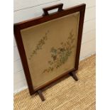 A fire screen with needle work framed to centre (H75cm W53cm)