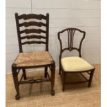 An oak rush seated hall chair on bun feet with turned stretchers and a mahogany cream upholstered