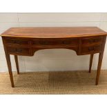 A yew sideboard, bow fronted four drawer configuration (H79cm W130cm D51cm)