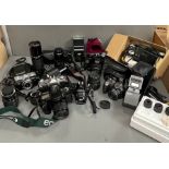 A large selection of camera, lens and flashes, various makers including Pentax, Cannon and Minolta