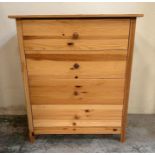 A four drawer pine chest of drawers