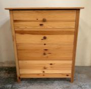 A four drawer pine chest of drawers
