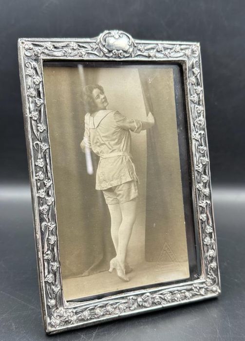 A good Art Nouveau silver embossed photograph frame, Birmingham 1901, together with period 1915