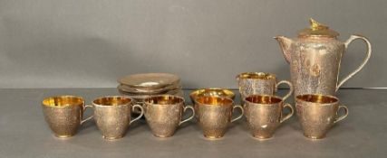 A Jersey Pottery coffee service in gold and flecked white