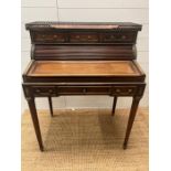 A mahogany tambour writing desk with brass galleried top and fluted legs (H100cm W80cm D50cm)