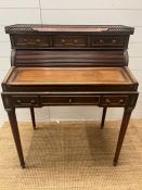 A mahogany tambour writing desk with brass galleried top and fluted legs (H100cm W80cm D50cm)