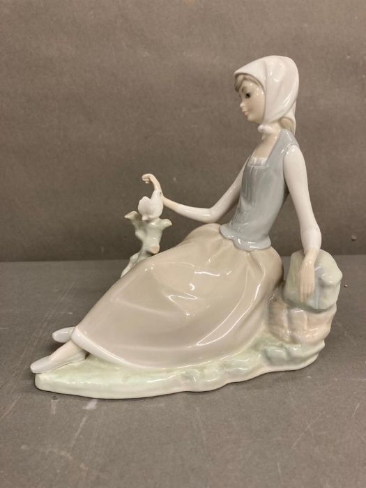 Shepherdess with Dove. Lladro. Designed by Vincente Martinez. #4660. Marked “Lladro Made in Spain”