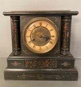 An eight day wooden cased mantle clock hand painted in a slate and marble style