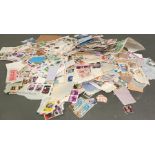 A quantity of loose UK and World stamps