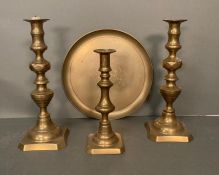 A selection of brass items to include candle sticks and a plate