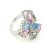 A multi topaz and diamond dress ring Diamond weight 0.84ct Ring is stamped 18K 750 Ring size O