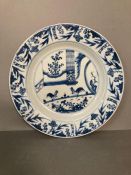 A Chinese blue and white plate with cockerels and floral border
