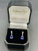 A pair of pear shaped sapphire and diamond drop earrings by local acclaimed jeweller Anthony Paul