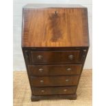 A mahogany ladies writing desk with green leather top (H99cm W54cm D42cm)