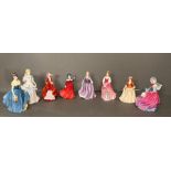 A selection of eight Royal Doulton figures to include Winter Day, Melanie, Laura and Autumn Breeze