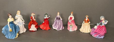 A selection of eight Royal Doulton figures to include Winter Day, Melanie, Laura and Autumn Breeze