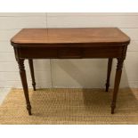 A mahogany gate legged dining table on turned legs (H75cm W94cm D47cm)